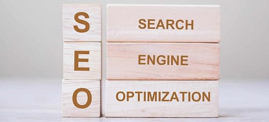 6 wooden blocks on a white background that spell SEO and search engine optimization as header on learn seo for free guide